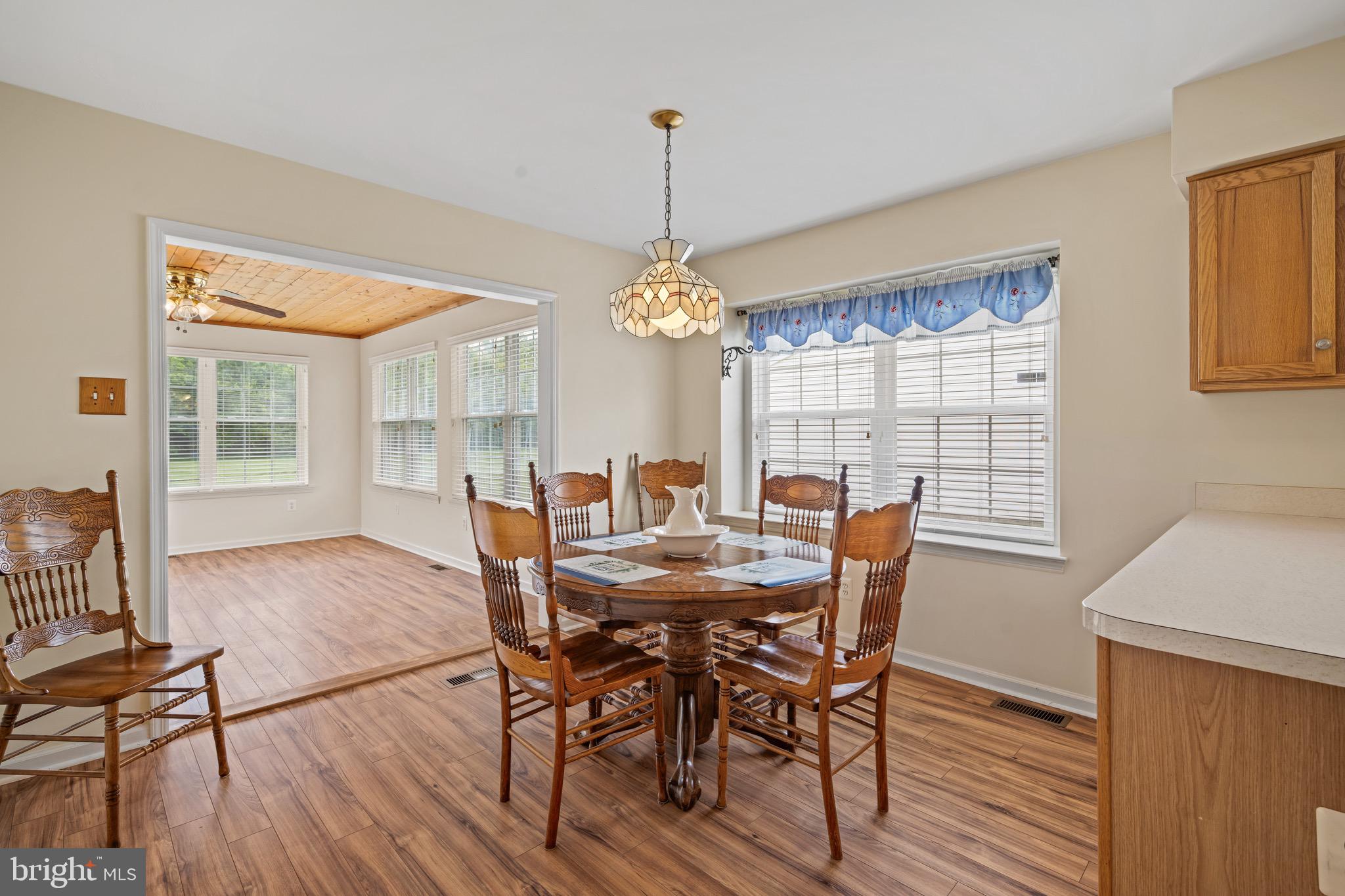 231 Gaunt Drive Mickleton, NJ 08056 - Photo 12 of 28 a view of a dining room with furniture window and wooden floor