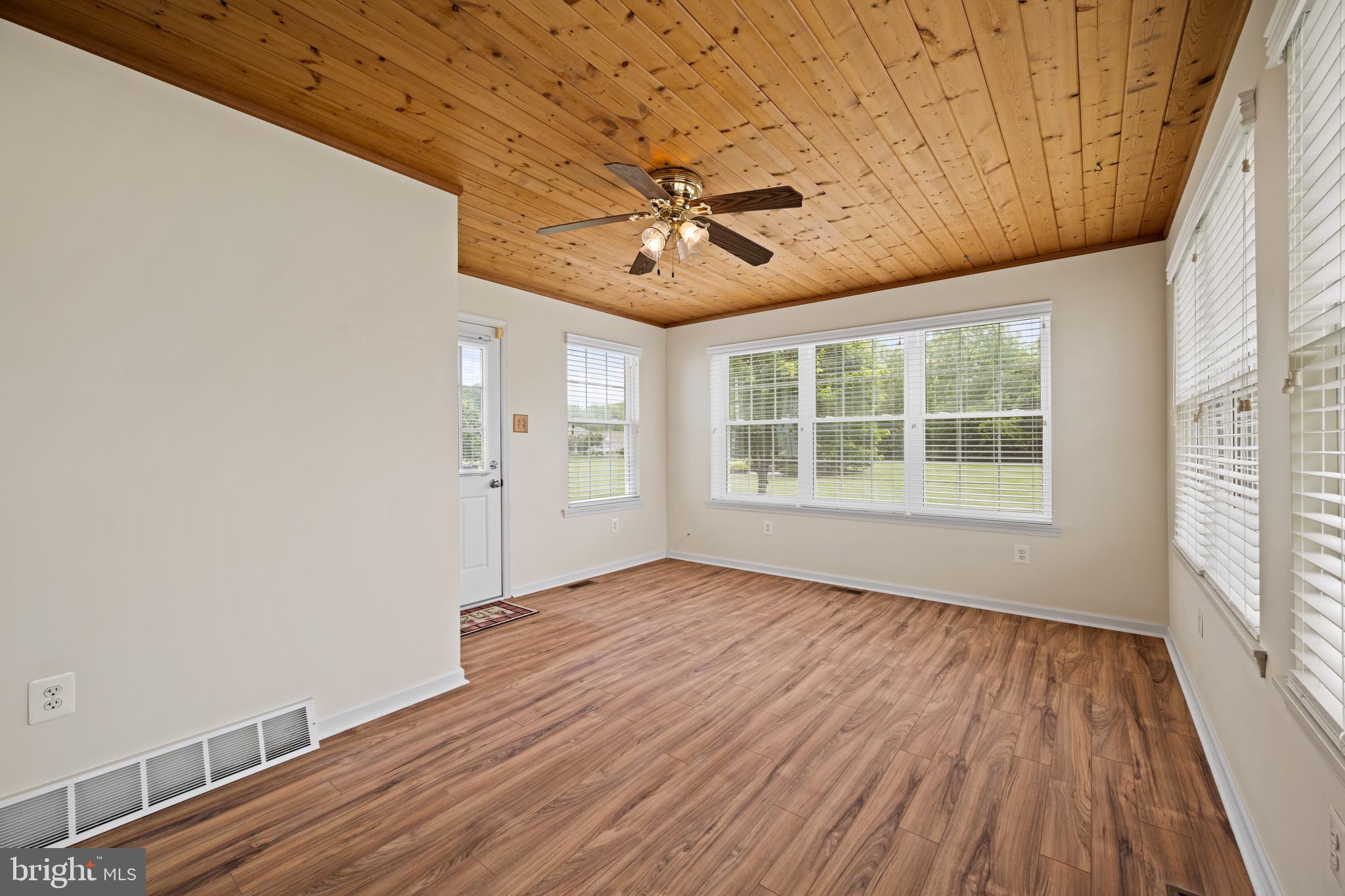 231 Gaunt Drive Mickleton, NJ 08056 - Photo 14 of 28 wooden floor in an empty room with a window