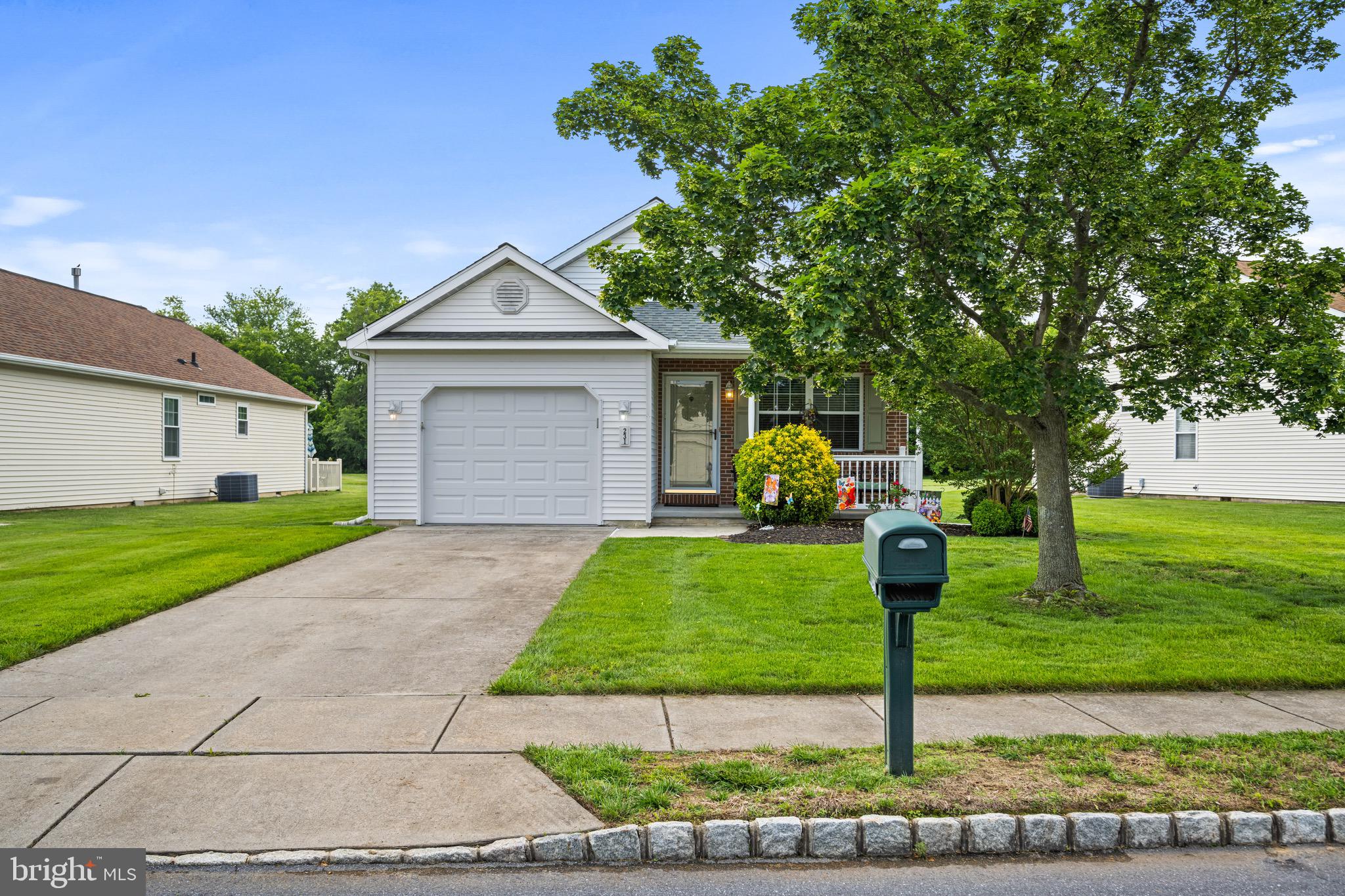 231 Gaunt Drive Mickleton, NJ 08056 - Photo 2 of 28 a front view of a house with garden