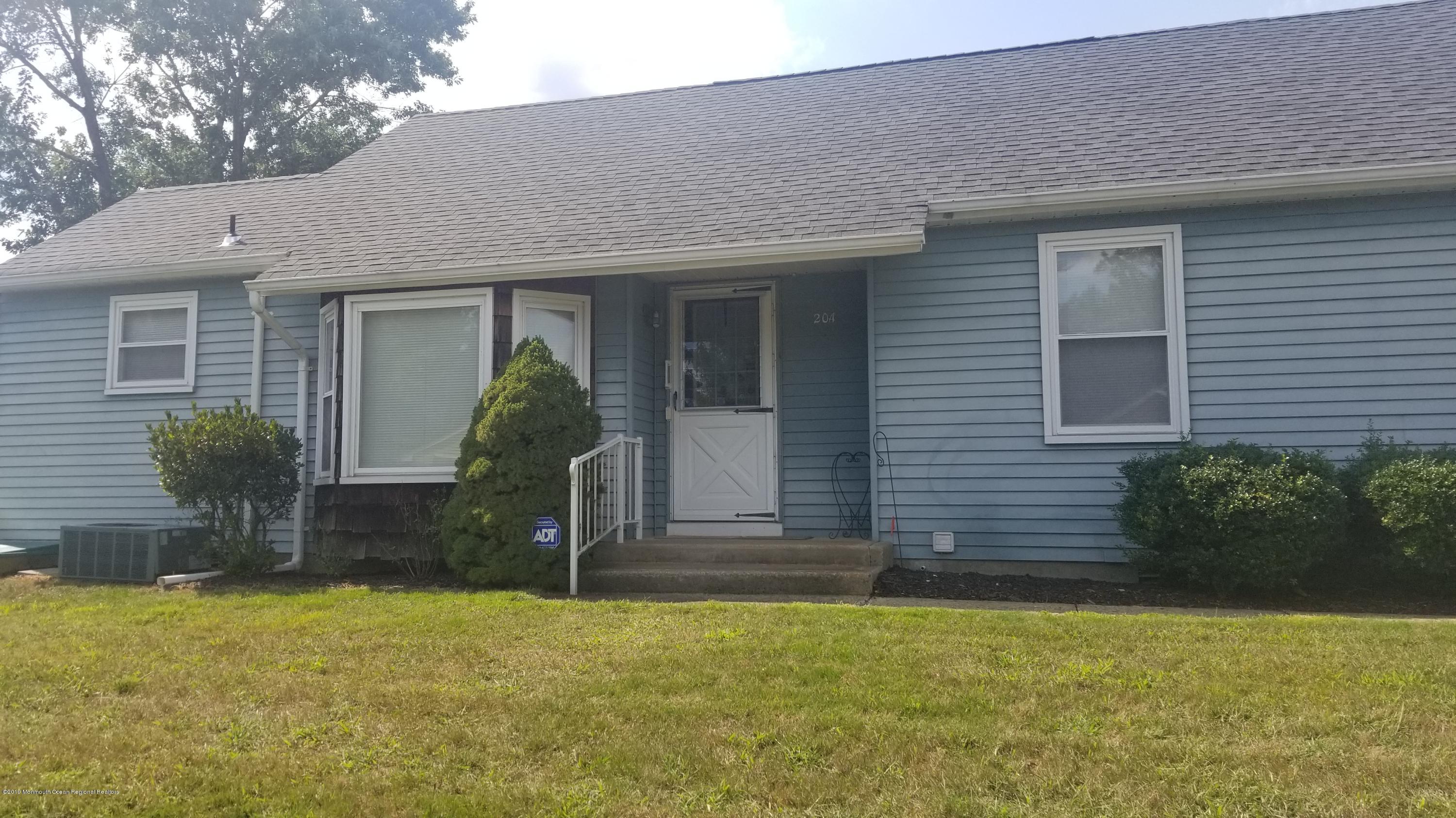 20D Ashley Road, Unit A Whiting, NJ 08759 - Photo 1 of 29 a front view of a house with garden