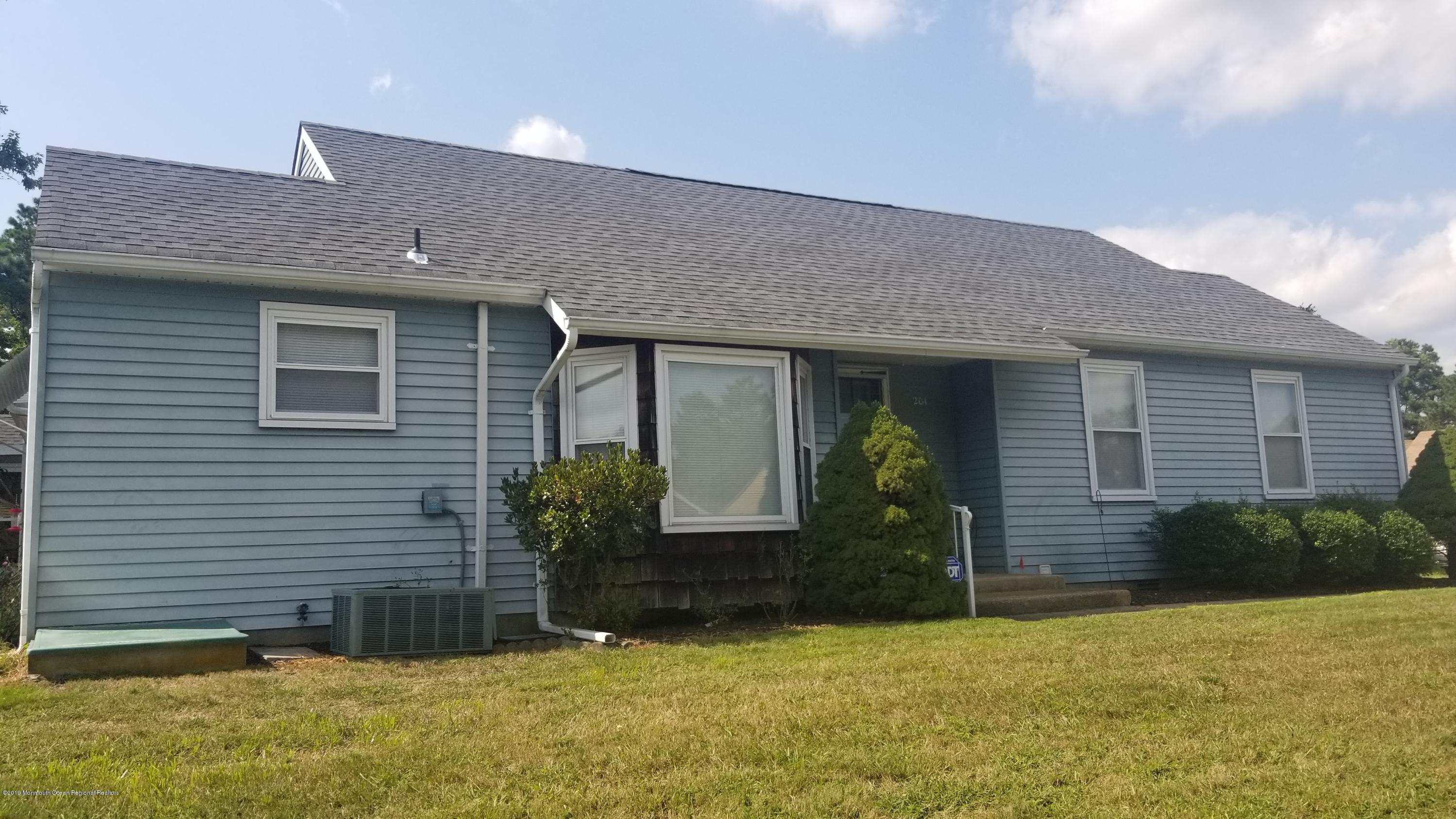 20D Ashley Road, Unit A Whiting, NJ 08759 - Photo 2 of 29 a front view of a house with garden