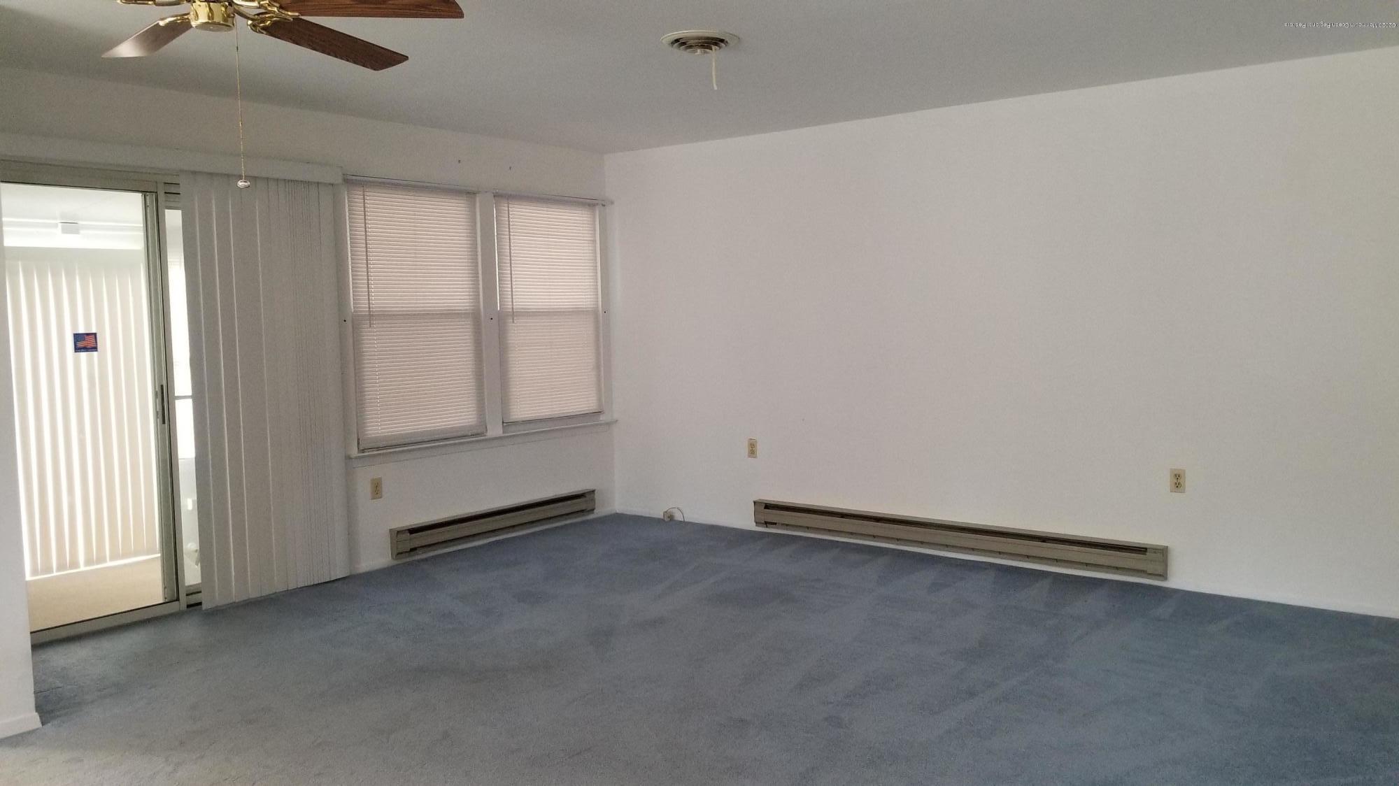 20D Ashley Road, Unit A Whiting, NJ 08759 - Photo 14 of 29 an empty room with windows