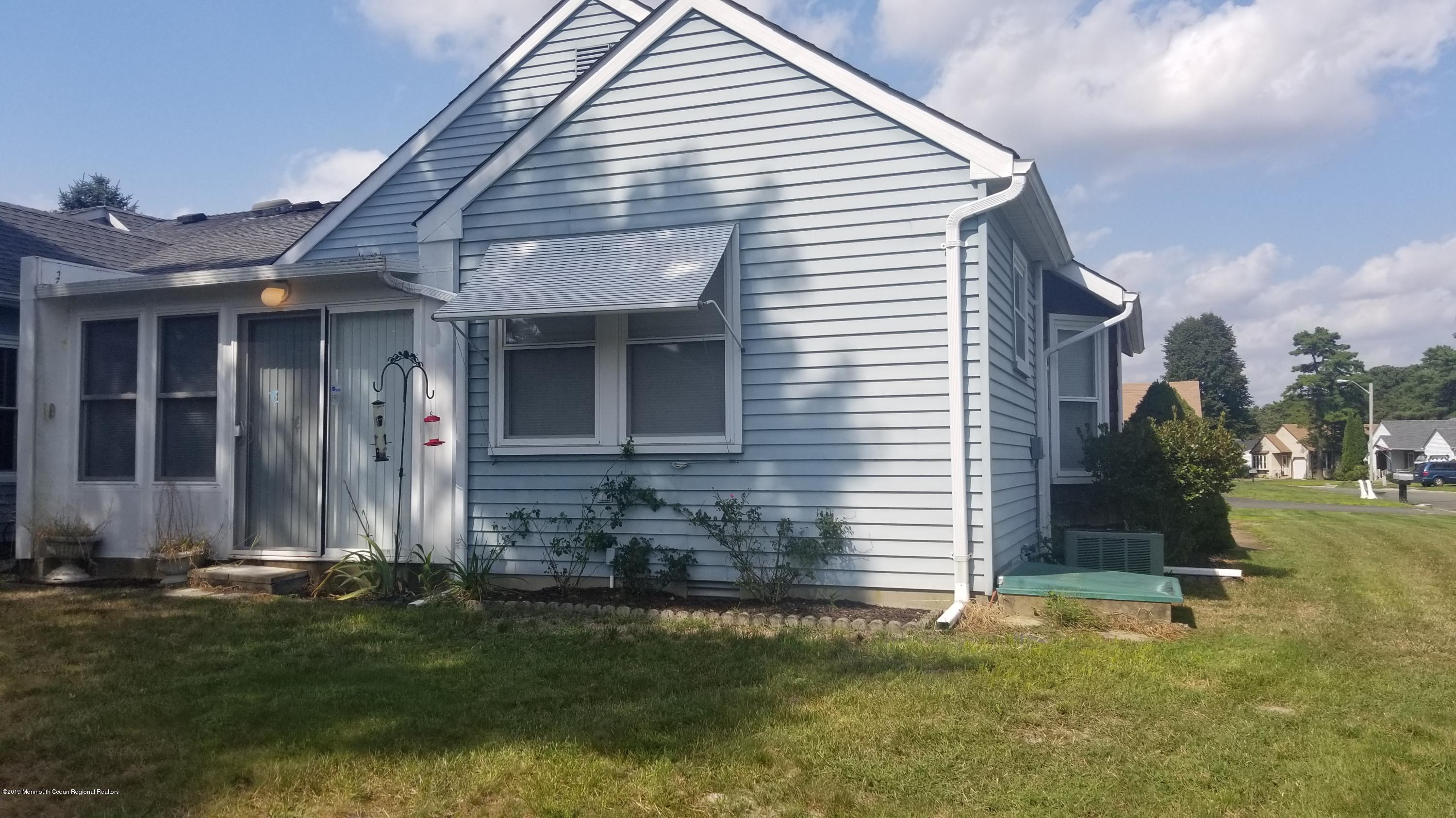 20D Ashley Road, Unit A Whiting, NJ 08759 - Photo 3 of 29 a front view of house with a garden