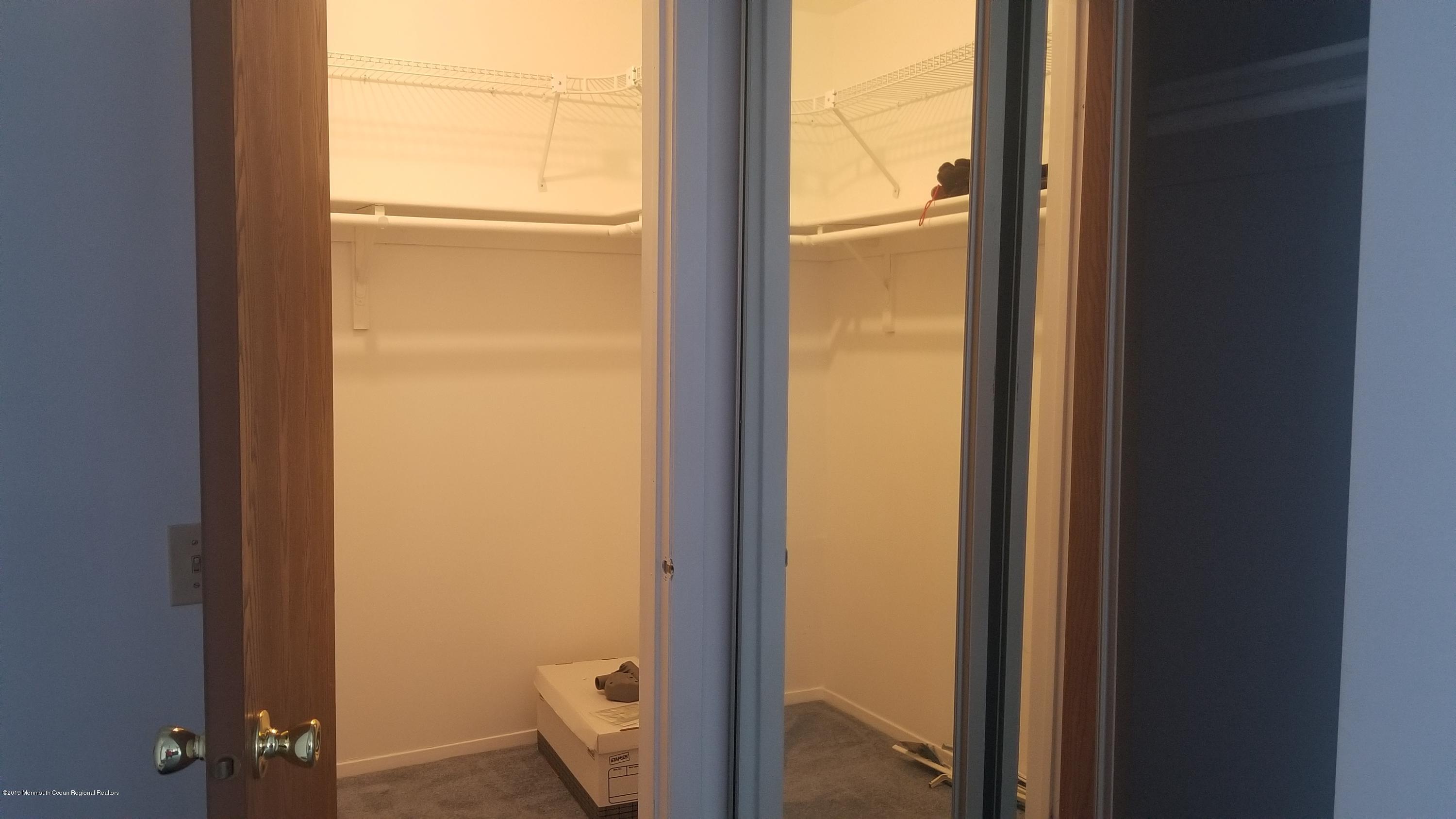 20D Ashley Road, Unit A Whiting, NJ 08759 - Photo 21 of 29 a view of a bathroom with a glass door