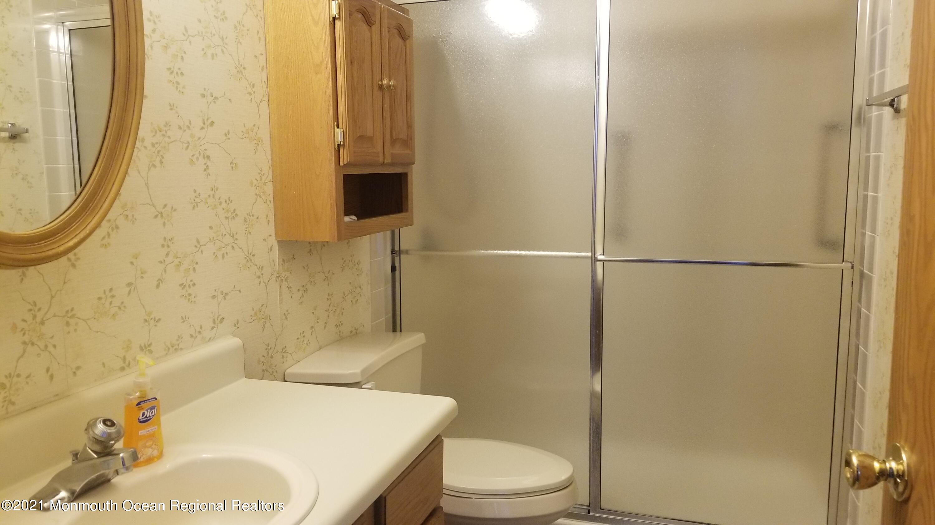 20D Ashley Road, Unit A Whiting, NJ 08759 - Photo 22 of 29 a bathroom with a sink toilet and shower