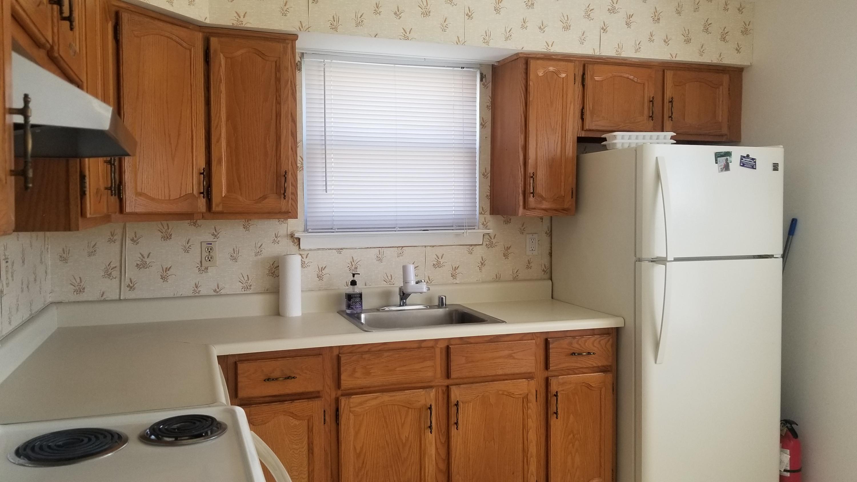 20D Ashley Road, Unit A Whiting, NJ 08759 - Photo 4 of 29 a kitchen with a refrigerator and a sink