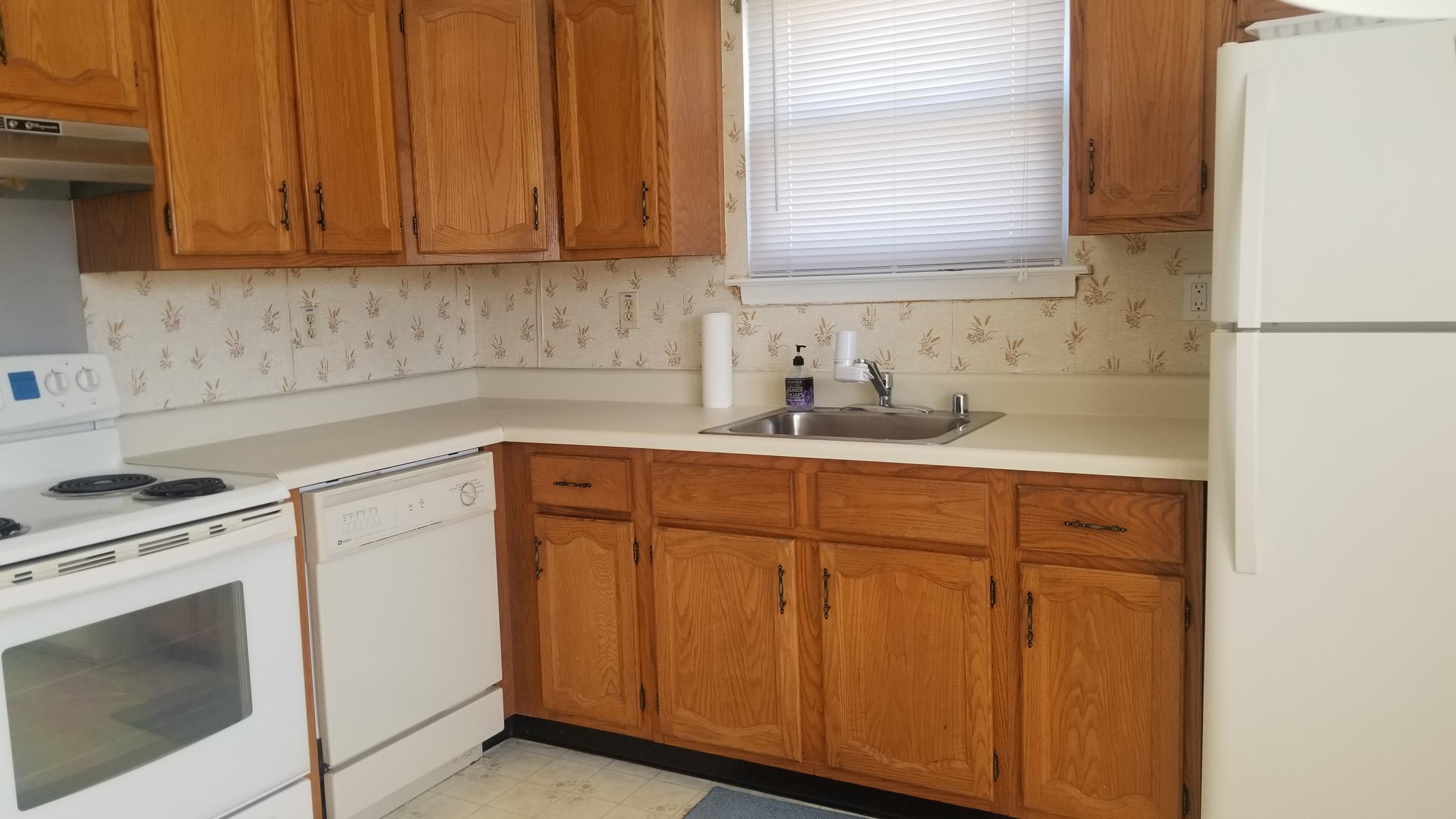 20D Ashley Road, Unit A Whiting, NJ 08759 - Photo 5 of 29 a kitchen with a sink cabinets appliances and a window