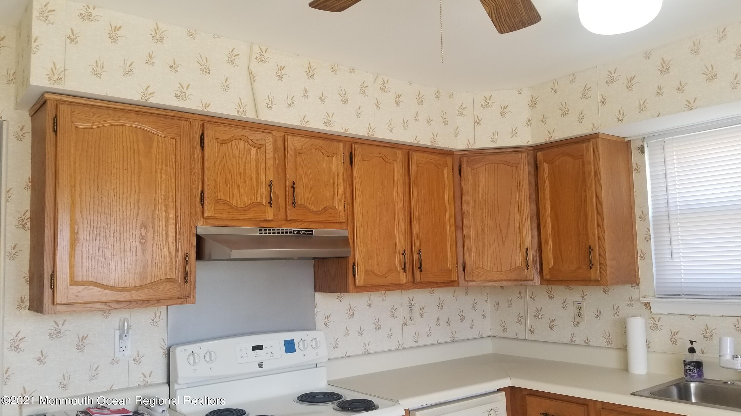 20D Ashley Road, Unit A Whiting, NJ 08759 - Photo 7 of 29 a bathroom with a sink and a window
