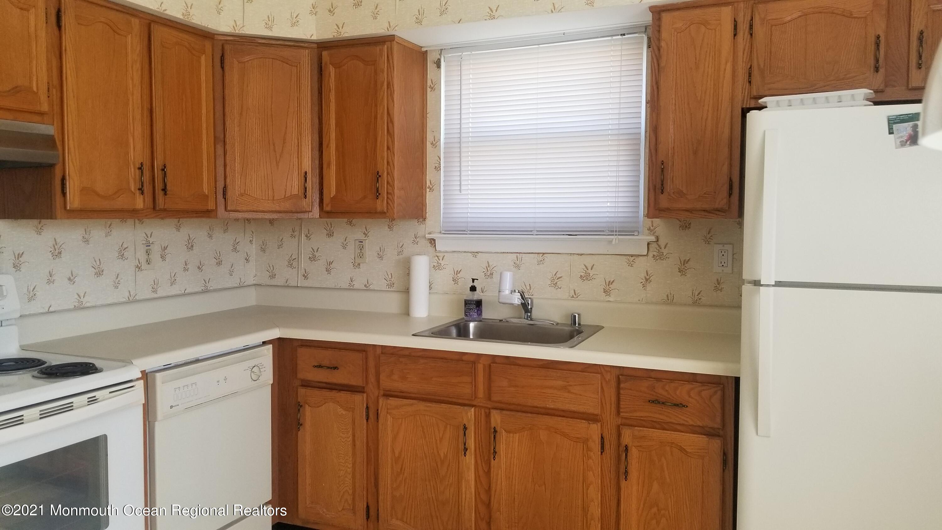 20D Ashley Road, Unit A Whiting, NJ 08759 - Photo 9 of 29 a kitchen with a sink cabinets and appliances