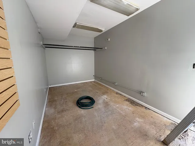 a bathroom with a sink mirror and toilet