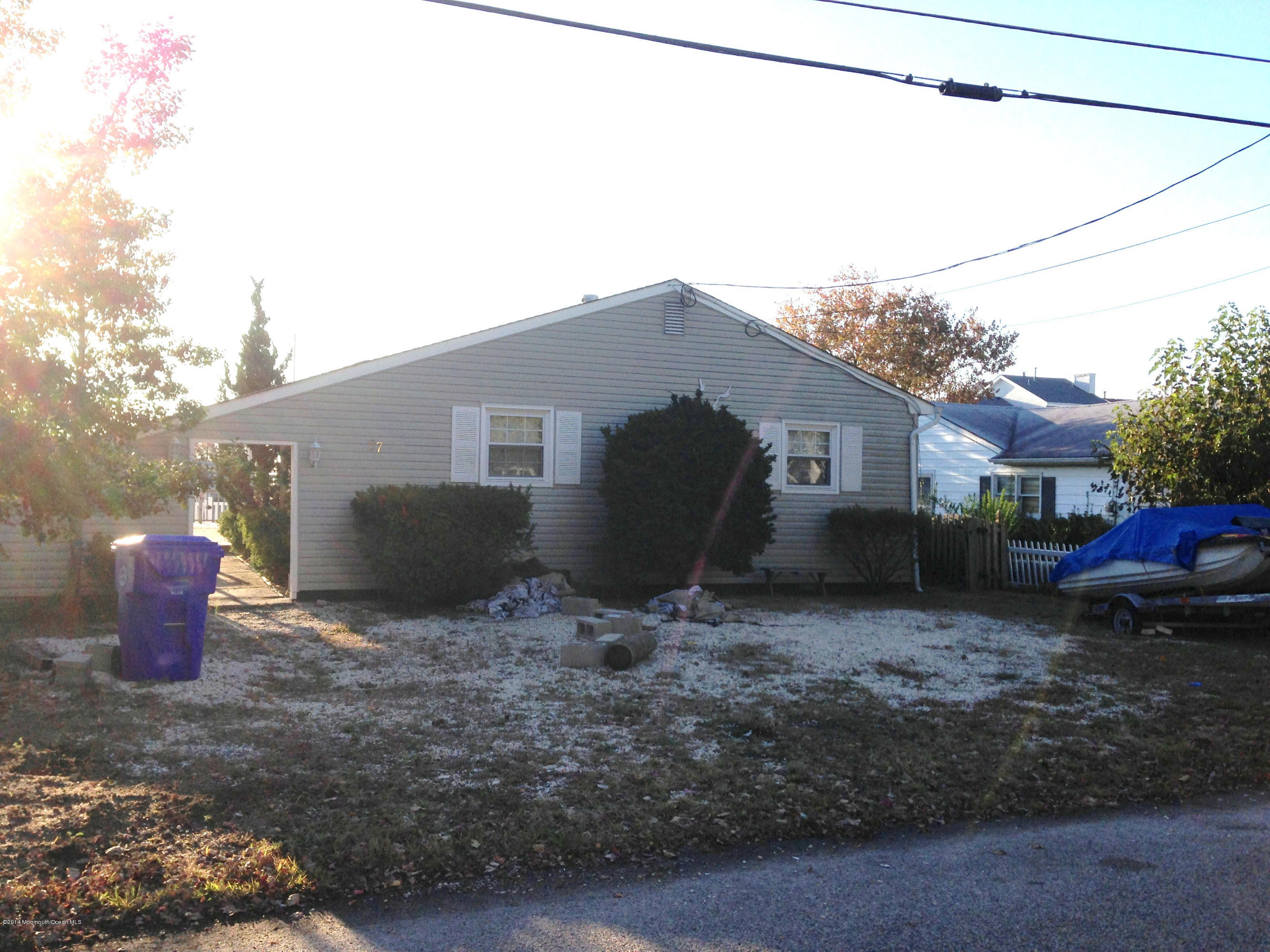 27 Cross Trees Road Brick, NJ 08723 - Photo 15 of 17 a backyard of a house with barbeque oven table and chairs