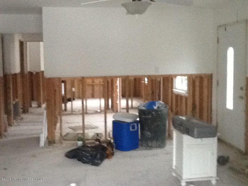 27 Cross Trees Road Brick, NJ 08723 - Photo 7 of 17 a living room with furniture and a floor to ceiling window