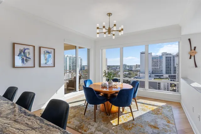 a view of a balcony a chair and wooden floor