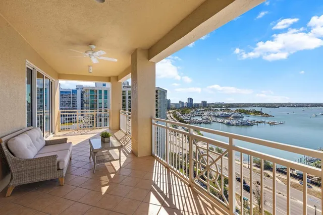 a view of a balcony with chairs