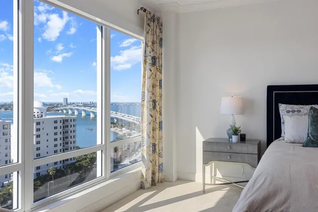 a view of a living room and a balcony