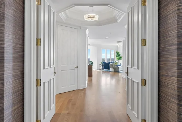 a living room with fireplace furniture and a large window