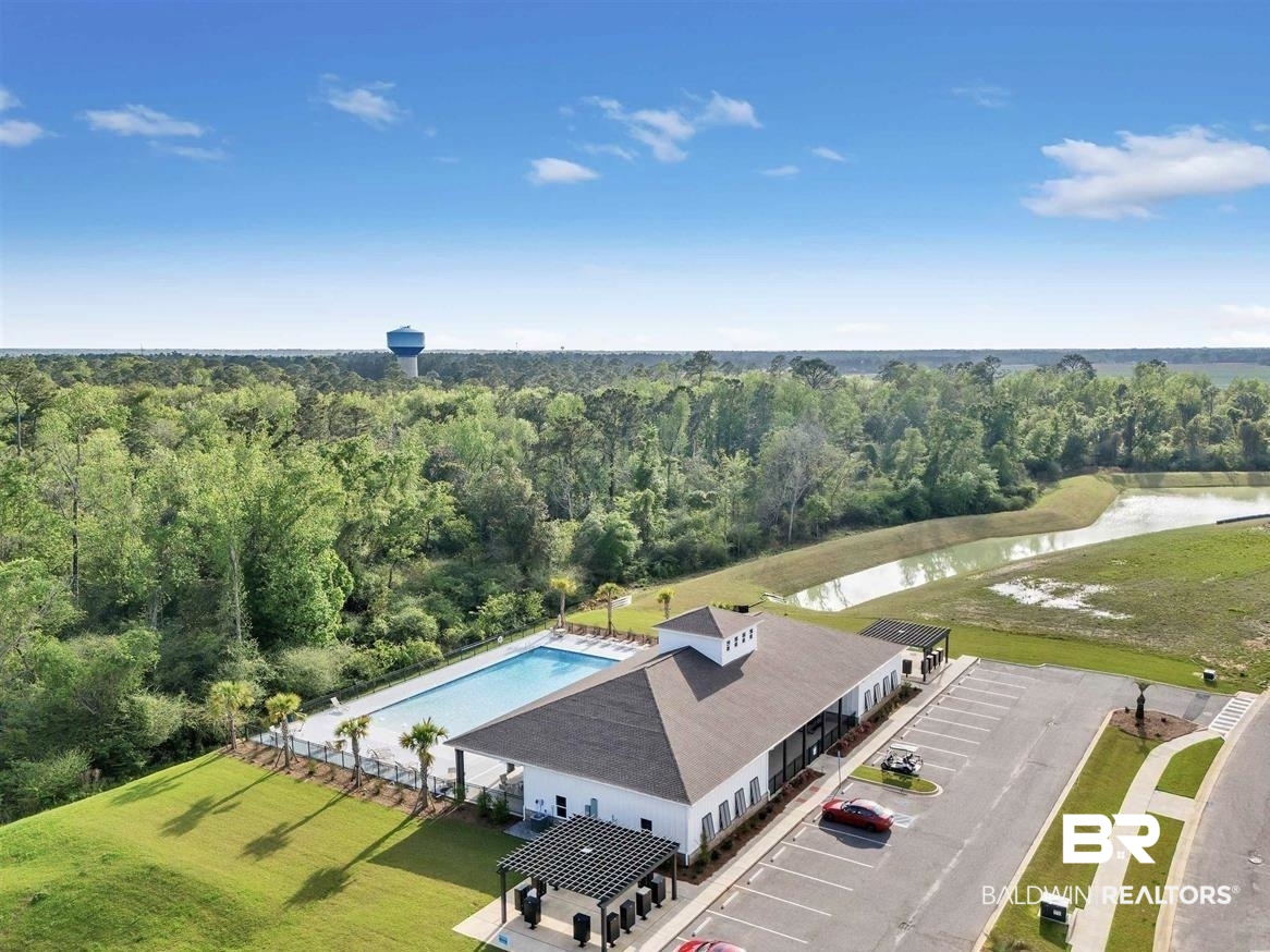 22348 Aleutian Avenue Foley, AL 36535 - Photo 29 of 32 Aerial view of a pool area and a large body of water