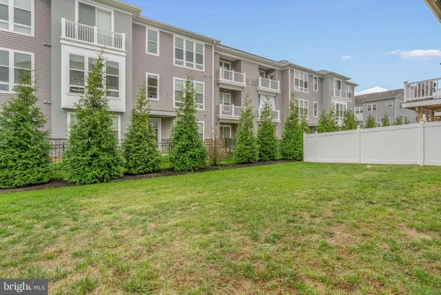 a view of an apartment with a garden and plants