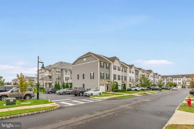 a view of a street with a building in the background
