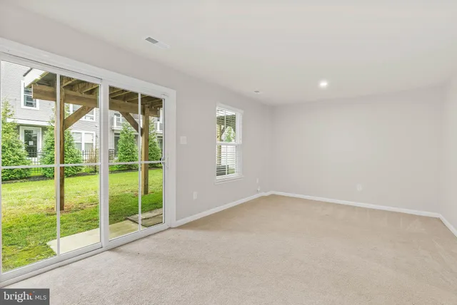 a view of an empty room with windows