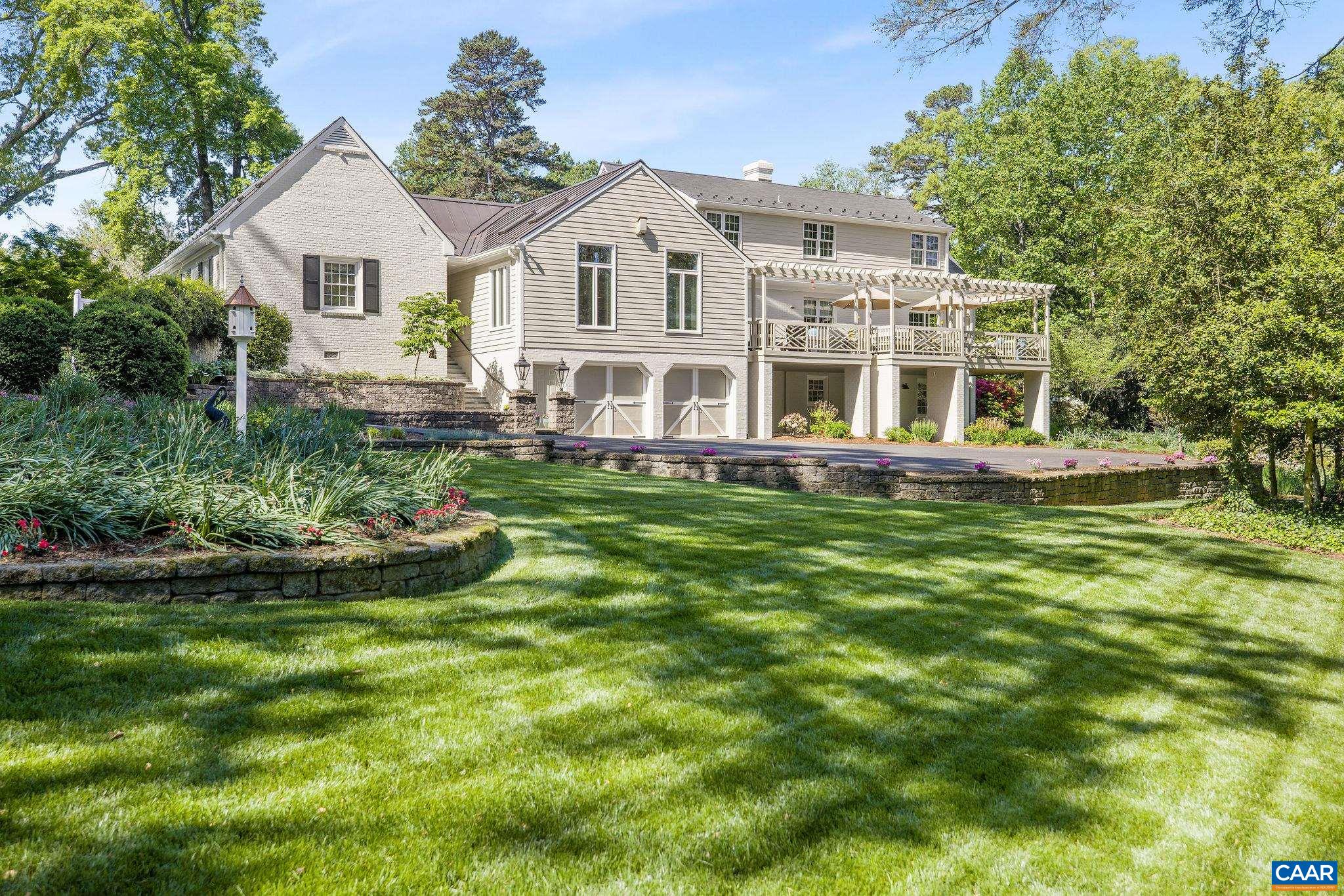 2001 Hessian Road Charlottesville, VA 22903 - Photo 1 of 47 a front view of a house with a garden