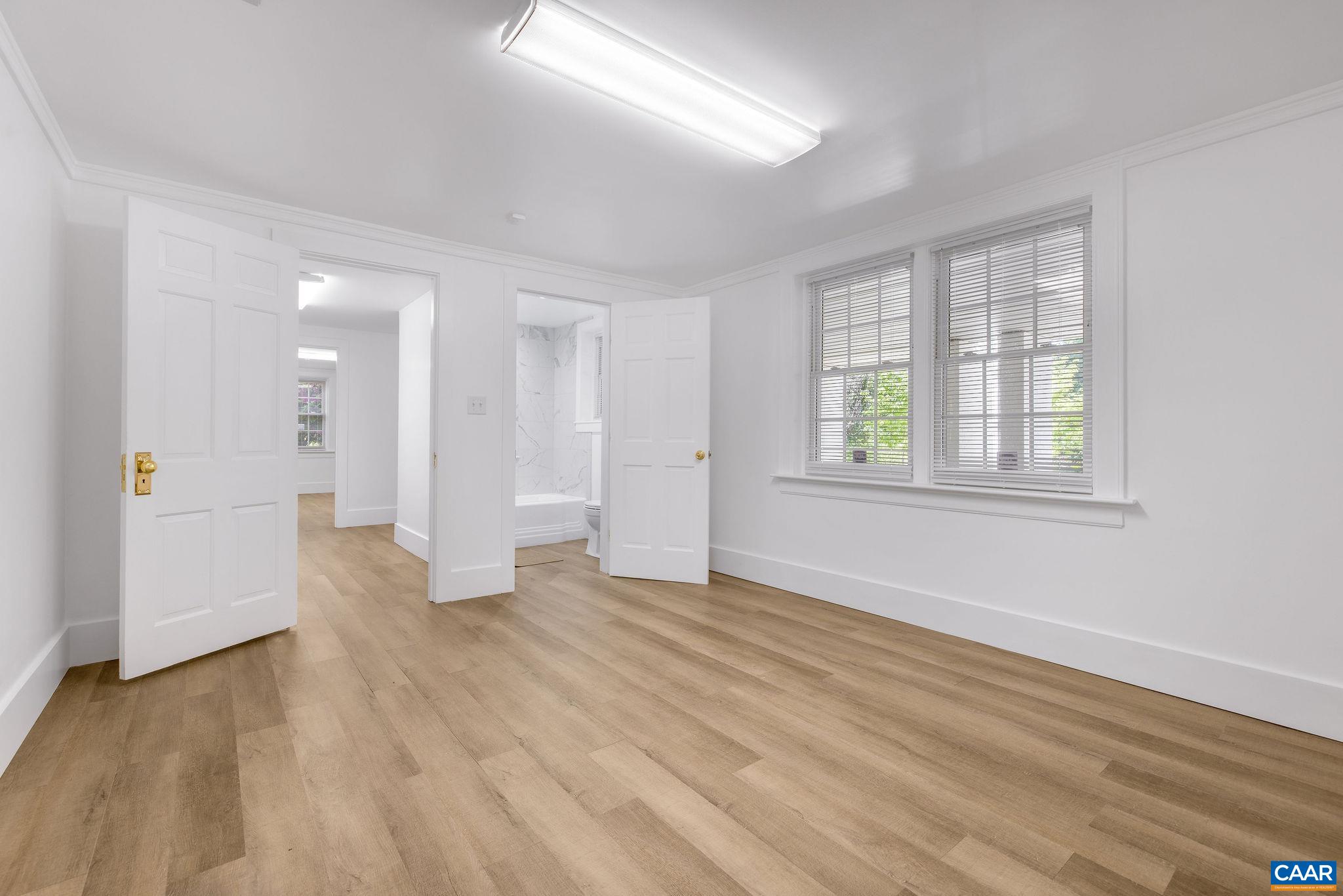 2001 Hessian Road Charlottesville, VA 22903 - Photo 34 of 47 wooden floor in an empty room with a window