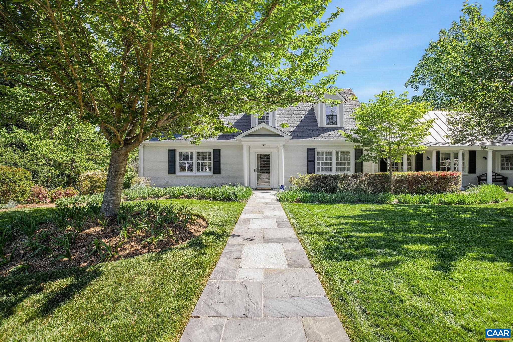 2001 Hessian Road Charlottesville, VA 22903 - Photo 4 of 47 a front view of a house with a garden