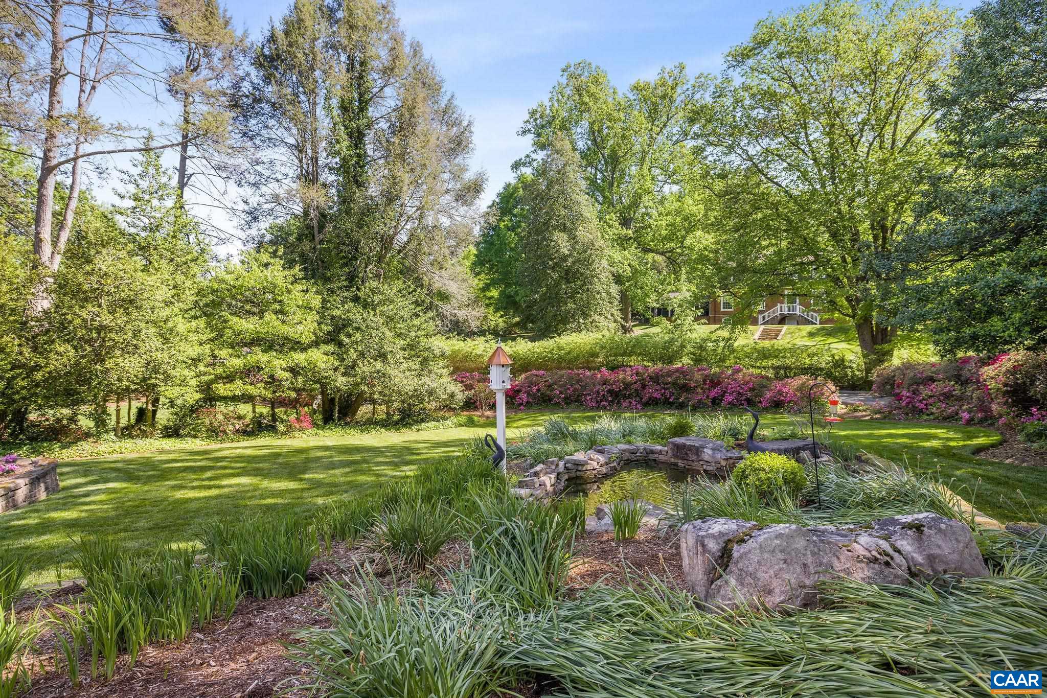 2001 Hessian Road Charlottesville, VA 22903 - Photo 42 of 47 a view of a garden with plants and large trees