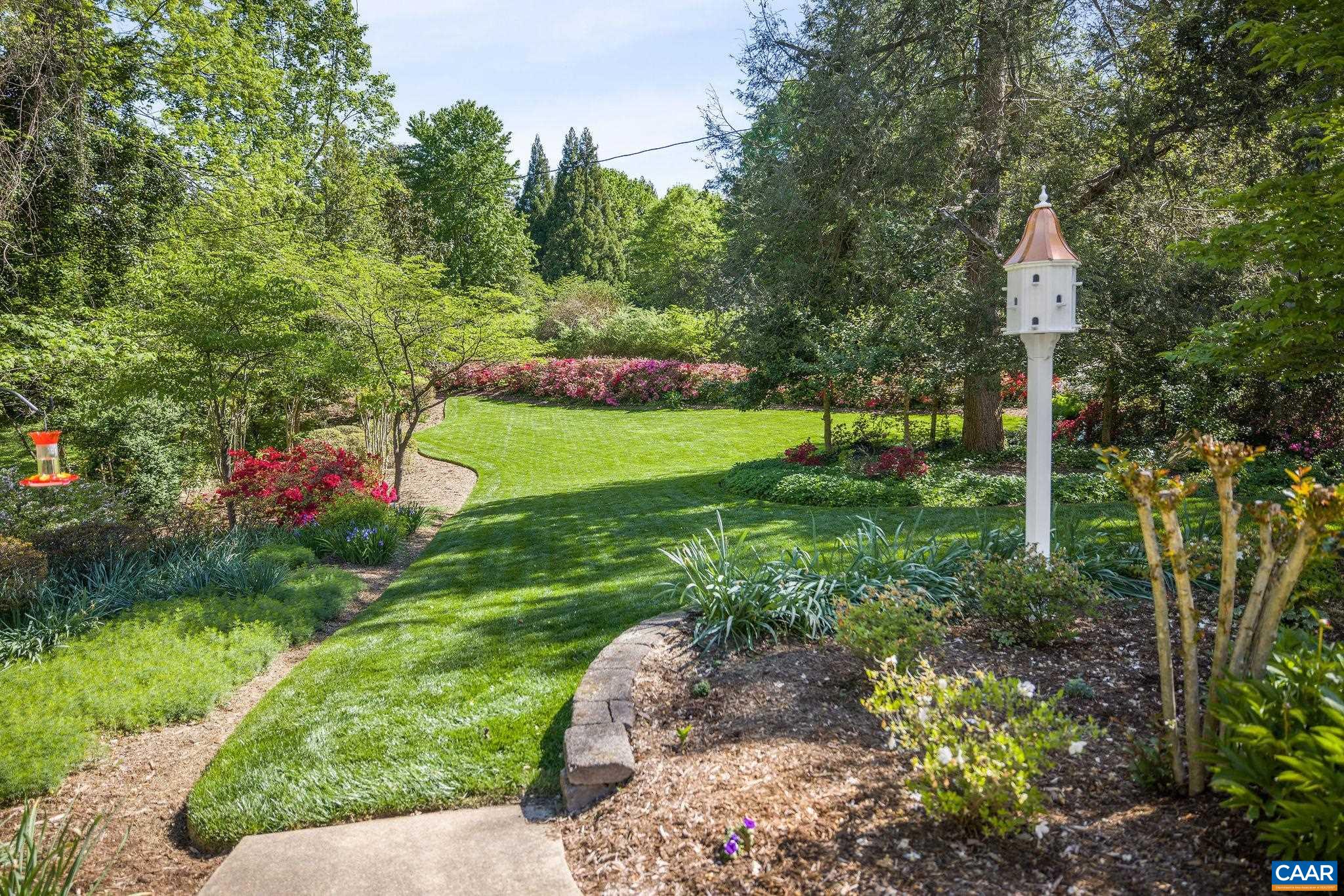 2001 Hessian Road Charlottesville, VA 22903 - Photo 46 of 47 a backyard of a house with a garden and outdoor seating