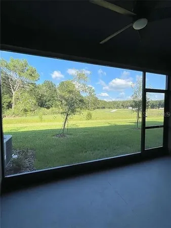 a view of a swimming pool with a yard