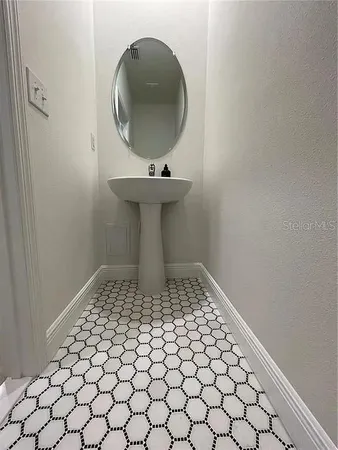 a bathroom with a sink and vanity