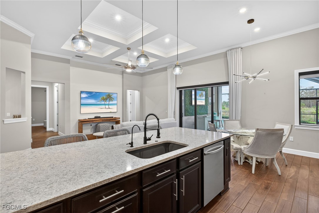 19815 Beverly Park Road Estero, FL 33928 - Photo 11 of 49 a kitchen with a sink a counter space appliances and cabinets