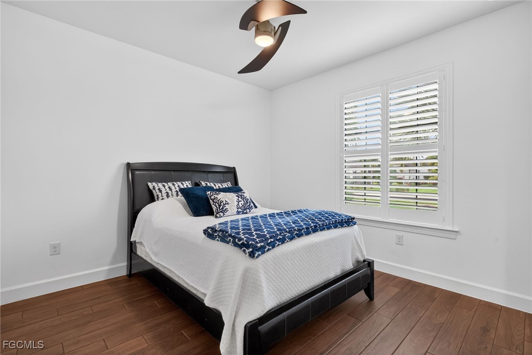 19815 Beverly Park Road Estero, FL 33928 - Photo 26 of 49 a bedroom with a bed and window