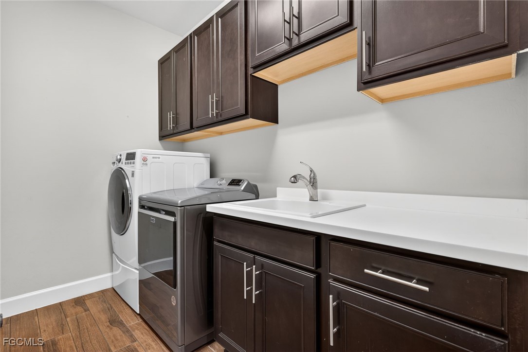 19815 Beverly Park Road Estero, FL 33928 - Photo 27 of 49 a utility room with sink dryer and washer