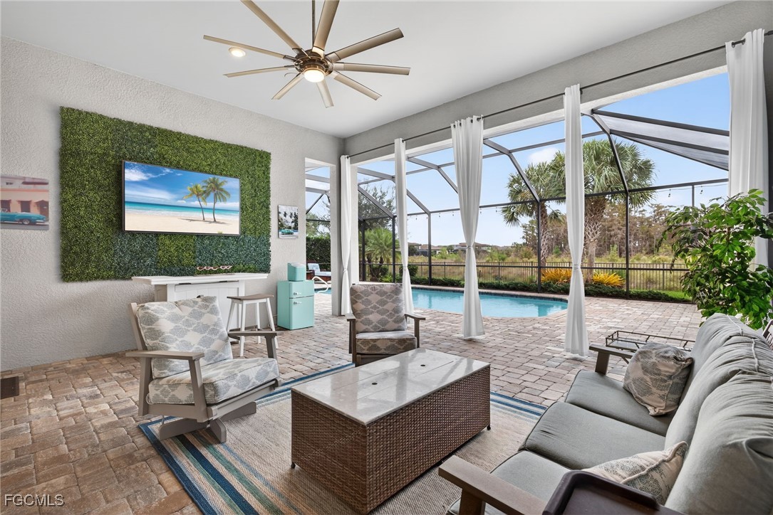 19815 Beverly Park Road Estero, FL 33928 - Photo 29 of 49 a living room with furniture and a large window