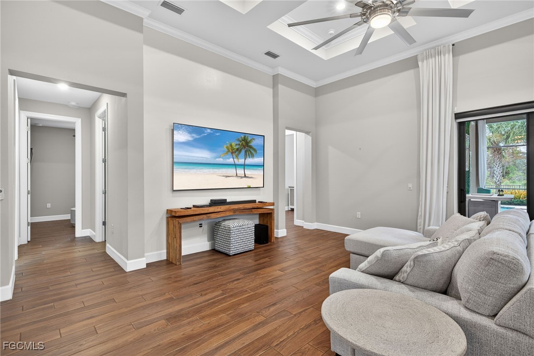 19815 Beverly Park Road Estero, FL 33928 - Photo 3 of 49 a living room with furniture a flat screen tv and a large window