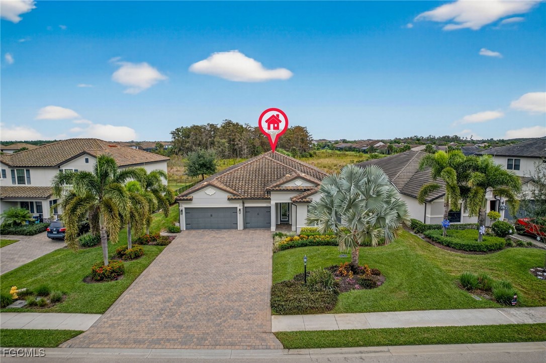 19815 Beverly Park Road Estero, FL 33928 - Photo 33 of 49 a view of a house with a yard and potted plants