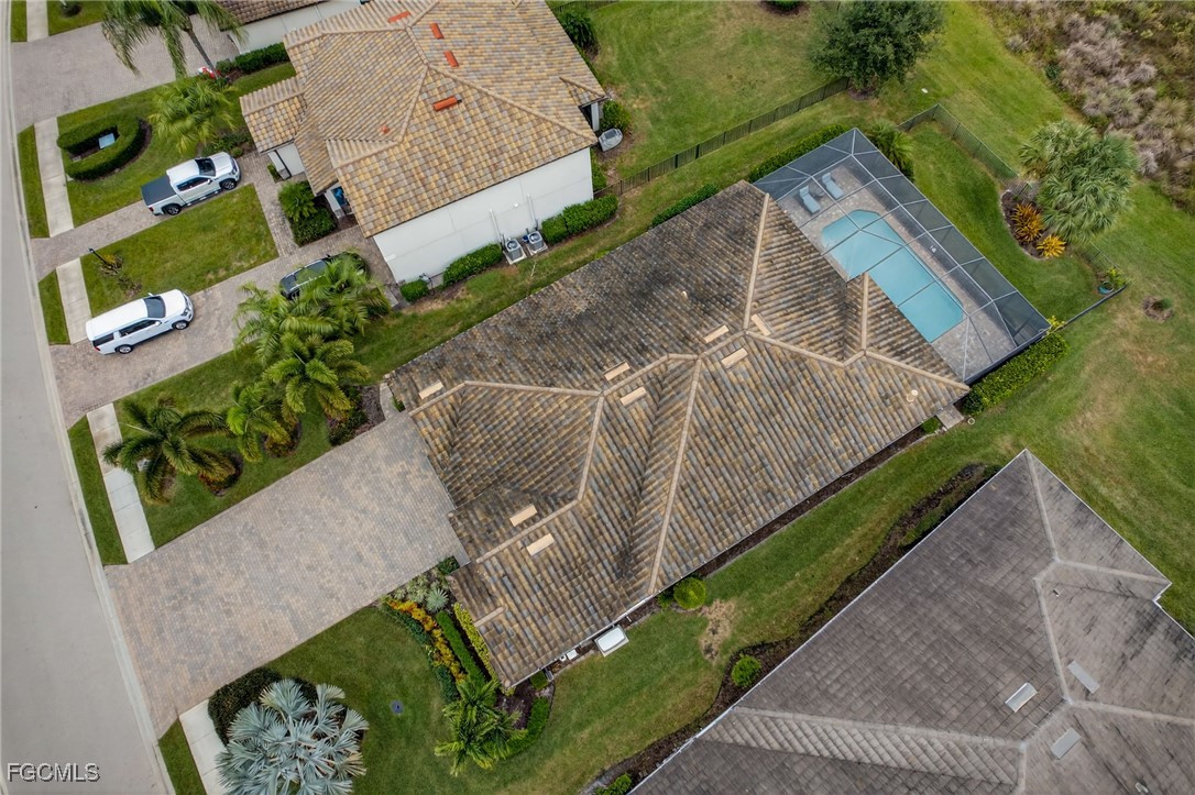 19815 Beverly Park Road Estero, FL 33928 - Photo 36 of 49 a view of a yard with potted plants