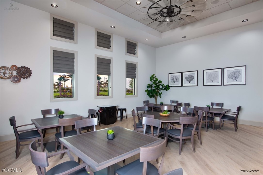 19815 Beverly Park Road Estero, FL 33928 - Photo 48 of 49 a view of a dining room with furniture window and wooden floor