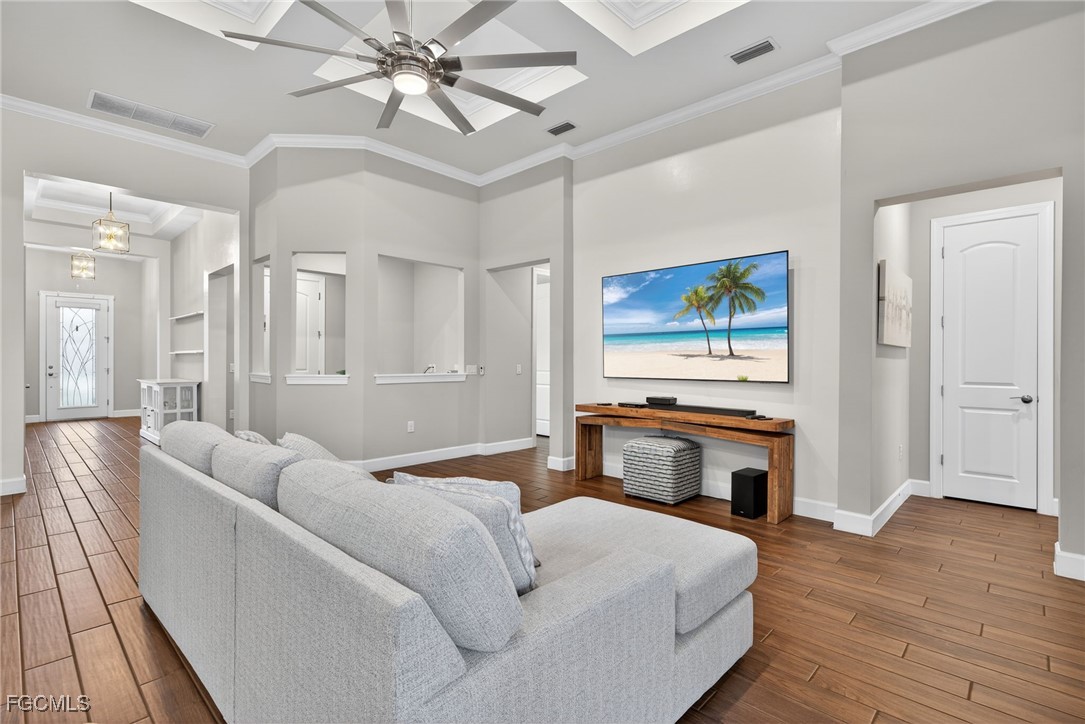 19815 Beverly Park Road Estero, FL 33928 - Photo 6 of 49 a bedroom with a bed and a chandelier