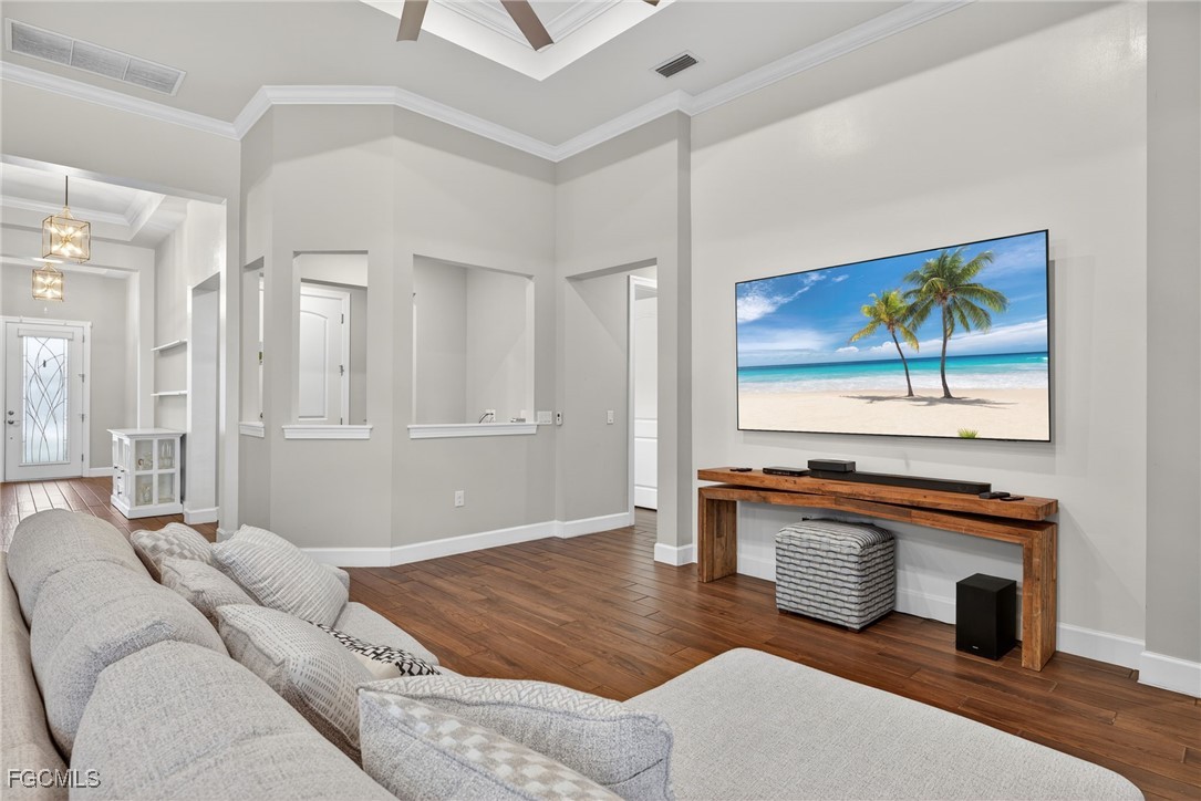 19815 Beverly Park Road Estero, FL 33928 - Photo 7 of 49 a living room with furniture a fireplace and a flat screen tv