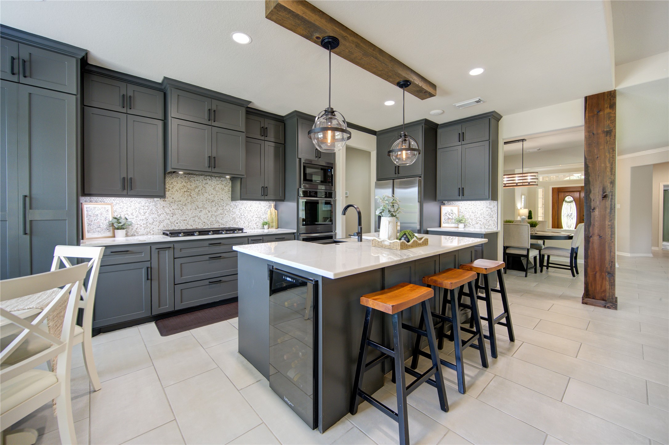 20026 Mellishaw Court Spring, TX 77379 - Photo 12 of 49 a kitchen with a table chairs sink and cabinets