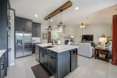 a view of a workspace with furniture and wooden floor