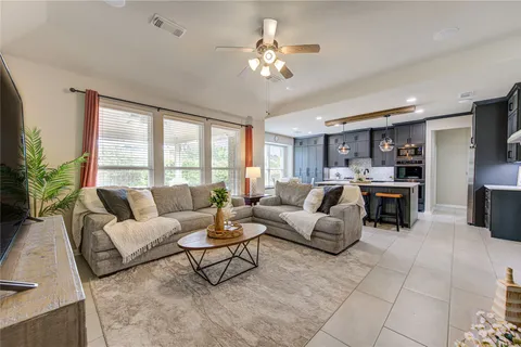 a bathroom with a double vanity sink mirror and toilet