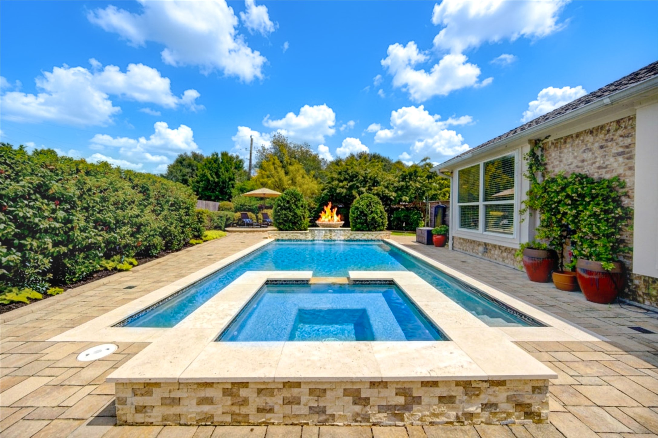 20026 Mellishaw Court Spring, TX 77379 - Photo 2 of 49 a view of an swimming pool with an outdoor seating