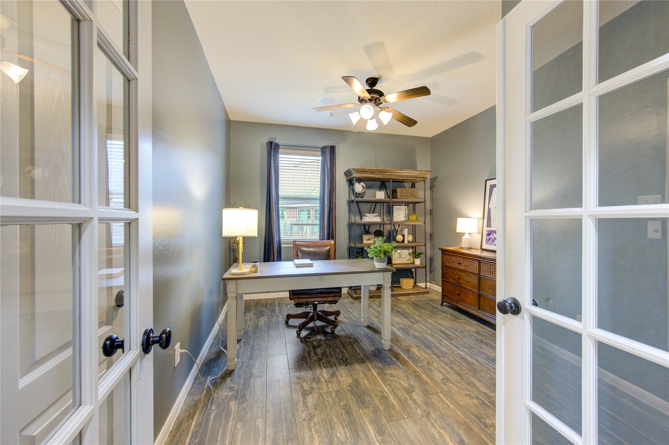 20026 Mellishaw Court Spring, TX 77379 - Photo 23 of 49 a view of a workspace with furniture and wooden floor