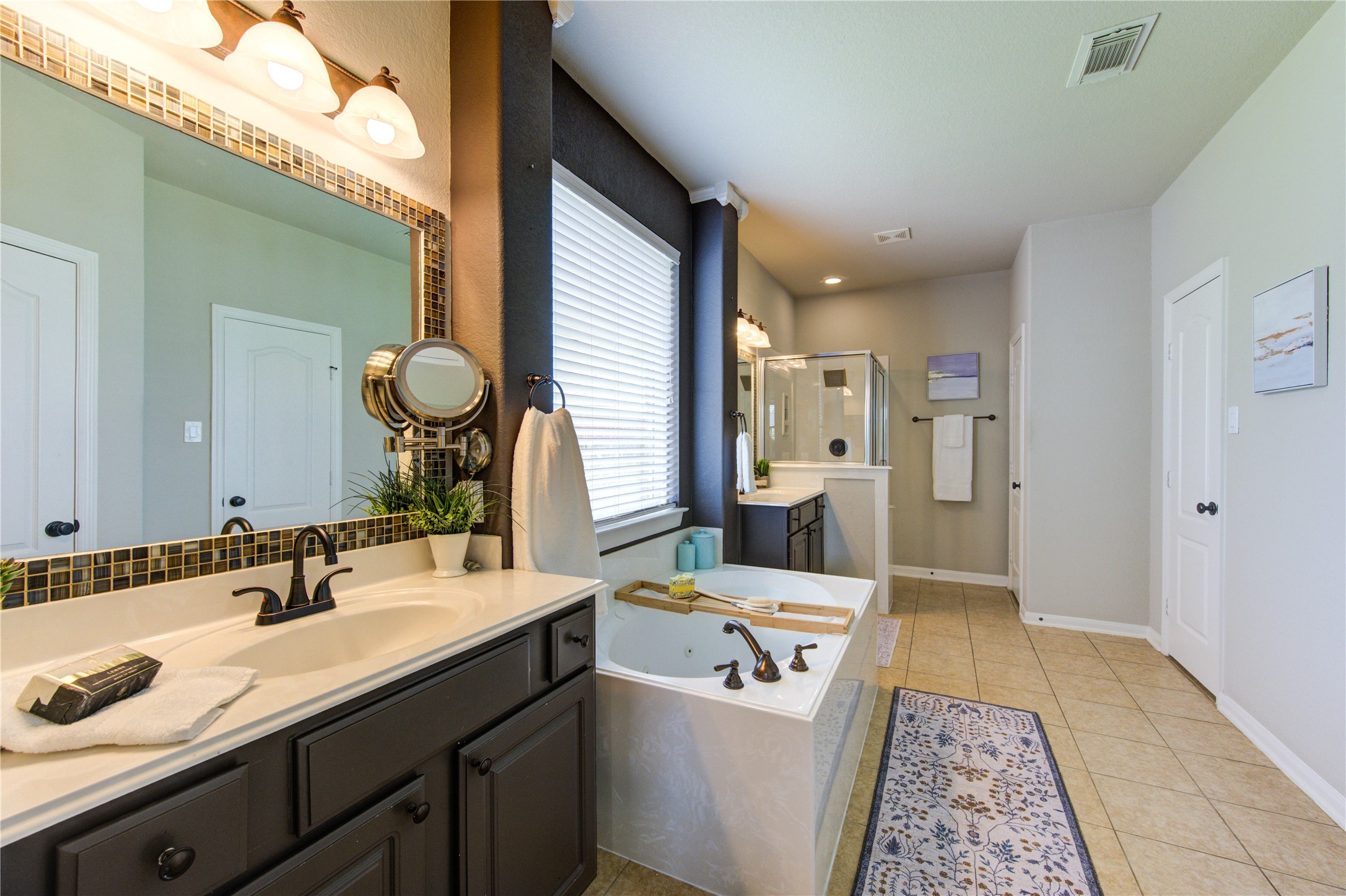 20026 Mellishaw Court Spring, TX 77379 - Photo 28 of 49 a bathroom with a sink a mirror and a toilet
