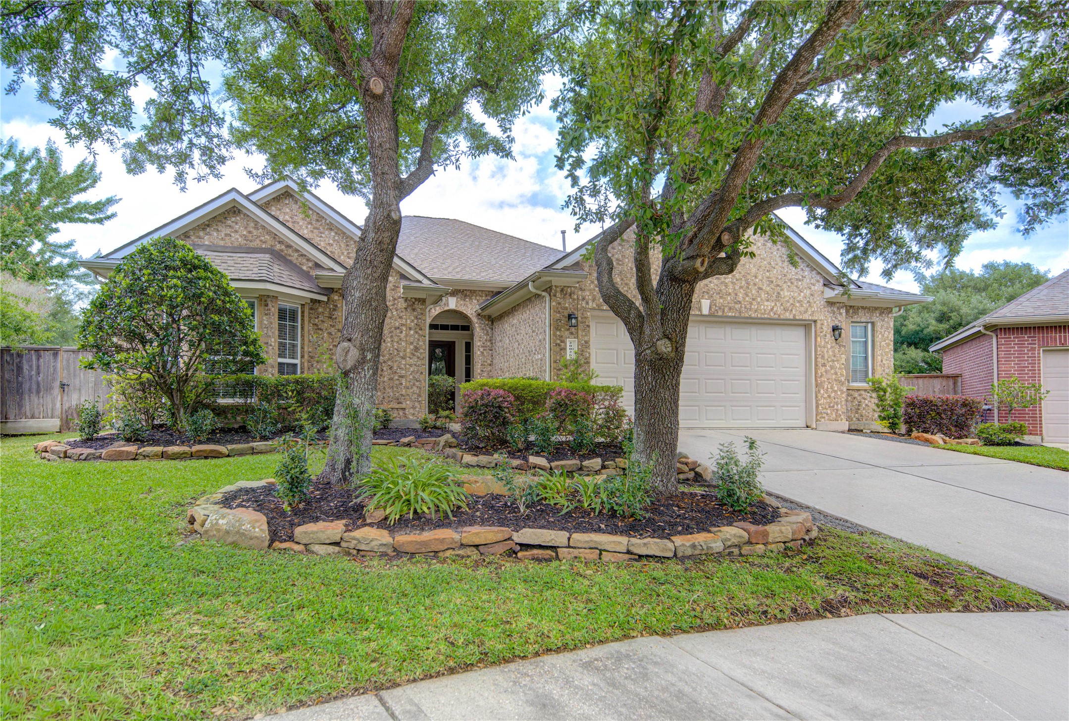 20026 Mellishaw Court Spring, TX 77379 - Photo 4 of 49 a front view of a house with a yard and garage