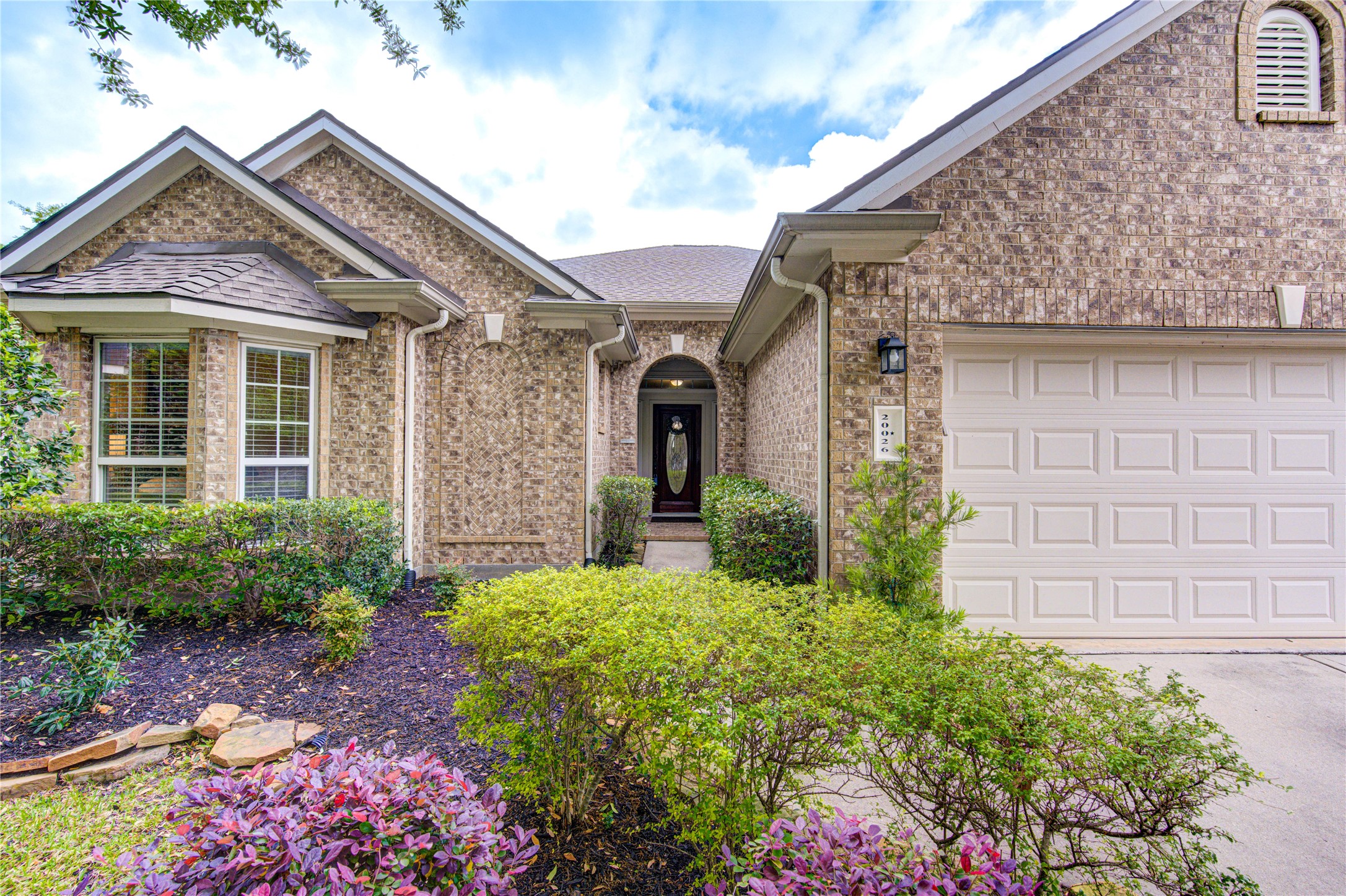 20026 Mellishaw Court Spring, TX 77379 - Photo 5 of 49 front view of a house with a small yard
