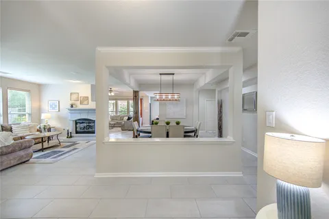 a view of a dining room with furniture and window